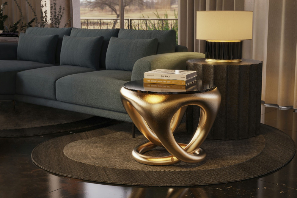 Ballad side table with gold leaf finish in a living room