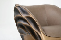 Triton armchair with aged gold color finish and leather upholstery